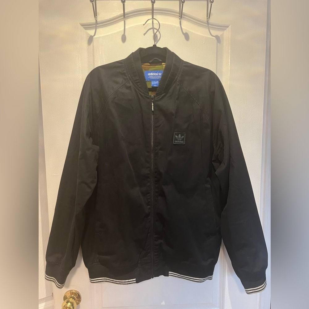 Adidas Men’s Navy blue lightweight jacket.